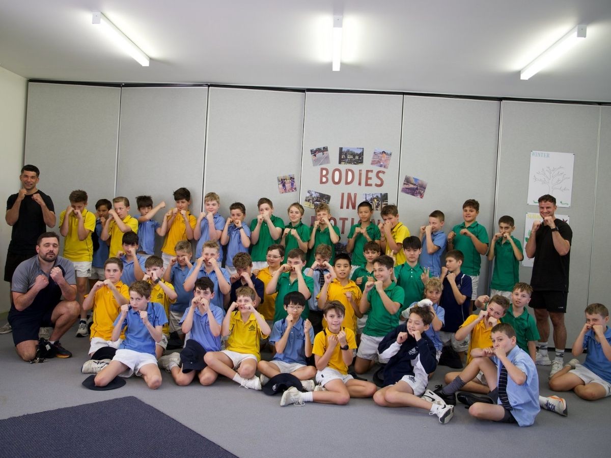 Boxing coach with kids
